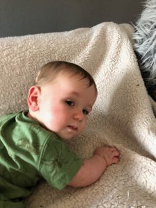 baby tumbles in blanket