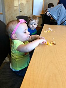 cute twins eating lunch